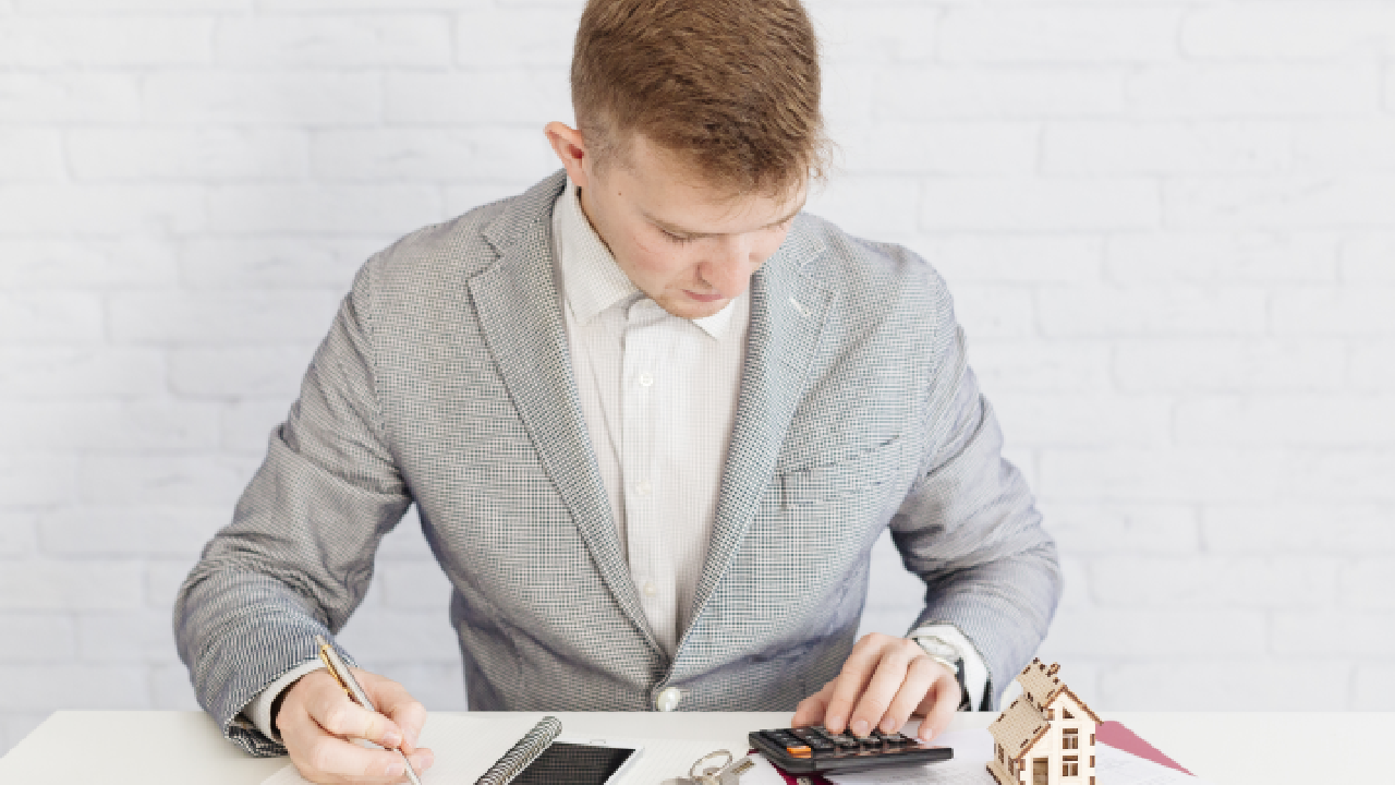 A digital art image of a key and a stack of money, symbolizing securing a commercial property mortgage loan.